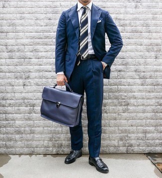 White and Navy Pocket Square Outfits: When the situation permits a relaxed casual ensemble, you can easily rock a navy suit and a white and navy pocket square. Finishing off with black leather monks is a fail-safe way to bring an extra touch of style to this ensemble.