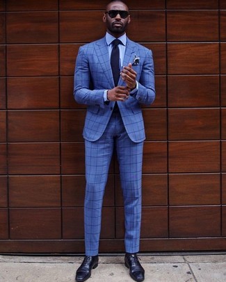 Navy Check Suit Outfits: We love how this pairing of a navy check suit and a light blue dress shirt instantly makes a man look classy and sharp. This ensemble is finished off nicely with a pair of navy leather oxford shoes.