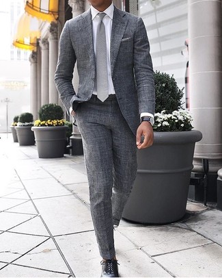 White and Black Gingham Pocket Square Outfits: This combination of a grey suit and a white and black gingham pocket square will prove your expertise in men's fashion even on weekend days. In the footwear department, go for something on the more elegant end of the spectrum by rounding off with a pair of black leather oxford shoes.