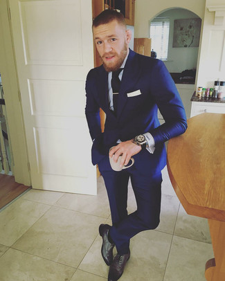 Conor McGregor wearing Navy Suit, Light Blue Vertical Striped Dress Shirt, Charcoal Leather Oxford Shoes, Black Tie