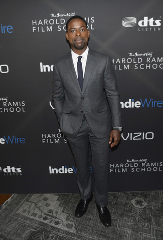 Sterling K. Brown wearing Charcoal Suit, White Dress Shirt, Black Leather Oxford Shoes, Navy Tie