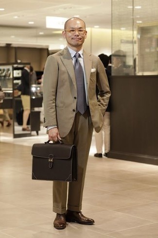 Dark Brown Leather Briefcase Summer Outfits: For a look that's pared-down but can be styled in a myriad of different ways, wear a tan suit and a dark brown leather briefcase. Lift up this getup with a pair of brown leather oxford shoes. You're sure to always look cool even despite the summer heat if you keep this outfit in your front hall closet.