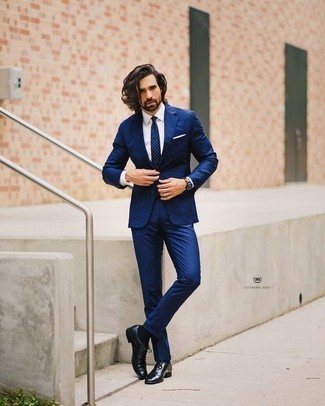 Blue Suit Outfits: Combining a blue suit and a white dress shirt is a surefire way to breathe a refined touch into your day-to-day routine. Black leather oxford shoes integrate effortlessly within a myriad of combos.