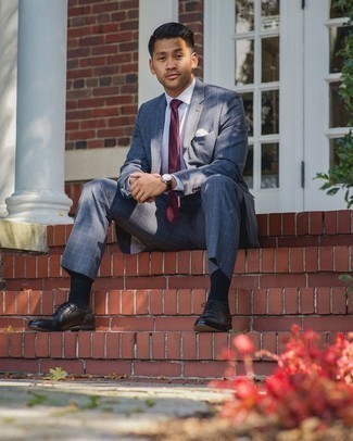 Burgundy Tie Outfits For Men: Pairing a grey check suit with a burgundy tie is a great choice for a sharp and polished ensemble. For a more relaxed take, introduce black leather oxford shoes to the mix.