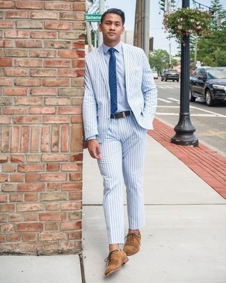 Tan Suede Oxford Shoes Outfits: You're looking at the irrefutable proof that a light blue vertical striped seersucker suit and a light blue dress shirt are amazing when combined together in a polished ensemble for today's man. Tan suede oxford shoes complete this look very well.