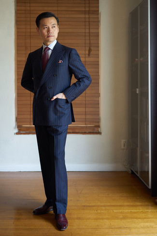 Red Pocket Square Outfits: This off-duty combo of a navy vertical striped suit and a red pocket square is perfect when you need to look cool and relaxed in a flash. Feeling transgressive today? Shake up this ensemble by sporting a pair of burgundy leather oxford shoes.