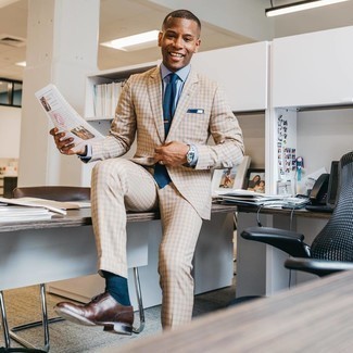 Tan Check Suit Outfits: Pairing a tan check suit and a light blue dress shirt will prove your outfit coordination prowess. Introduce a pair of dark brown leather oxford shoes to the mix and ta-da: this outfit is complete.