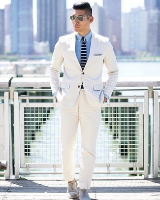 Navy and White Horizontal Striped Tie Outfits For Men: This polished pairing of a white suit and a navy and white horizontal striped tie will cement your styling chops. You can stick to a more casual route with footwear by wearing a pair of grey suede oxford shoes.