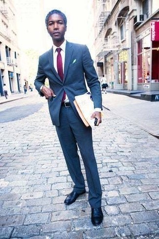 Purple Tie Outfits For Men: This pairing of a blue suit and a purple tie is the epitome of masculine refinement. To add a more casual twist to your look, add a pair of black leather oxford shoes to the mix.
