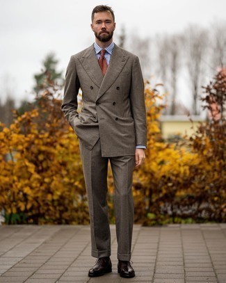 Orange Print Tie Outfits For Men: For an outfit that's classic and Bond-worthy, pair a brown check suit with an orange print tie. When in doubt about the footwear, complete this ensemble with a pair of dark brown leather oxford shoes.