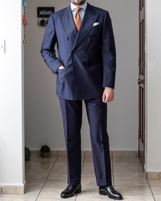 Tobacco Tie Outfits For Men: You're looking at the undeniable proof that a navy suit and a tobacco tie look amazing when married together in a classy look for today's gentleman. A pair of black leather oxford shoes immediately ups the cool of this look.