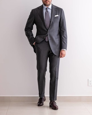 Navy Print Tie Outfits For Men: A charcoal suit and a navy print tie are a good pairing that will earn you the proper amount of attention. For footwear, you can stick to the casual route with dark brown leather oxford shoes.