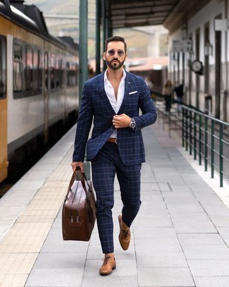 Brown Leather Holdall Outfits For Men: A navy check suit and a brown leather holdall are the ideal way to inject effortless cool into your current styling arsenal. A pair of brown leather oxford shoes immediately ups the style factor of your ensemble.