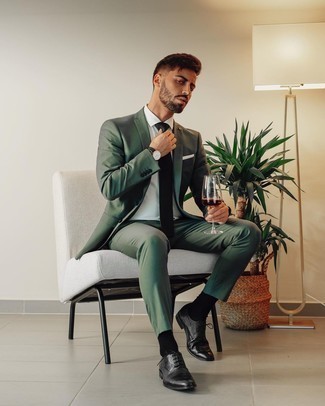 Black Leather Oxford Shoes Outfits: Teaming a dark green suit and a white dress shirt is a surefire way to inject your wardrobe with some masculine refinement. Complement this outfit with black leather oxford shoes and the whole look will come together wonderfully.