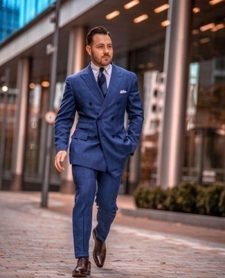 Navy Plaid Suit Outfits: Loving how this combo of a navy plaid suit and a white dress shirt immediately makes a man look classy and sharp. The whole ensemble comes together perfectly if you complete this ensemble with a pair of dark brown leather oxford shoes.