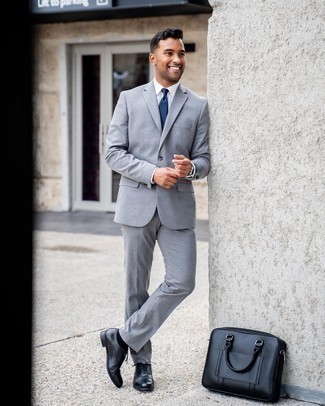 Black Leather Briefcase Outfits: Combining a grey suit with a black leather briefcase is a good idea for a laid-back but sharp ensemble. Add an elegant twist to an otherwise mostly dressed-down outfit by sporting a pair of black leather oxford shoes.