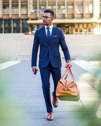 Tobacco Leather Holdall Outfits For Men: A navy suit and a tobacco leather holdall? It's an easy-to-create getup that you could sport on a day-to-day basis. If you want to immediately perk up this outfit with a pair of shoes, complete your outfit with brown leather oxford shoes.