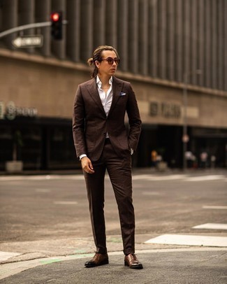 Dark Brown Suit Outfits: Loving how this pairing of a dark brown suit and a white dress shirt immediately makes a man look sharp and polished. Our favorite of a multitude of ways to complement this getup is a pair of dark brown leather oxford shoes.