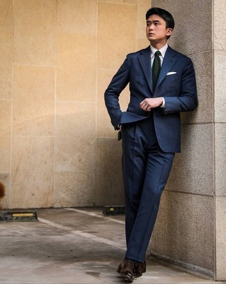 Dark Green Knit Tie Outfits For Men: Swing into something polished yet trendy in a navy vertical striped suit and a dark green knit tie. Our favorite of an infinite number of ways to round off this ensemble is dark brown leather oxford shoes.