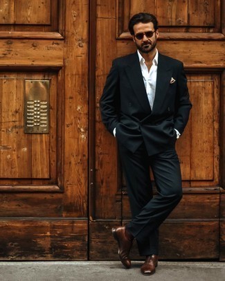 Black Suit Outfits: A black suit and a white dress shirt are an elegant combo that every smart man should have in his sartorial collection. If in doubt about the footwear, stick to dark brown leather oxford shoes.