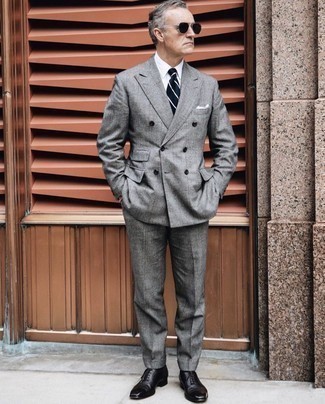 500+ Outfits For Men After 50: To look modern and dapper, choose a grey check suit and a white dress shirt. Add black leather oxford shoes to the equation and the whole getup will come together quite nicely. Now that's an outfit any 50-something man will appreciate.