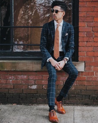 Dark Brown Floral Tie Outfits For Men: A navy check suit and a dark brown floral tie are among the crucial items in any modern gent's wardrobe. This look is finished off wonderfully with tobacco leather oxford shoes.
