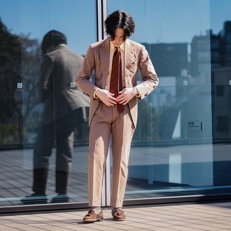 Dark Brown Horizontal Striped Tie Outfits For Men: Dress in a tan suit and a dark brown horizontal striped tie - this look will surely make a sartorial statement. Brown suede tassel loafers are the simplest way to give a sense of stylish nonchalance to this look.