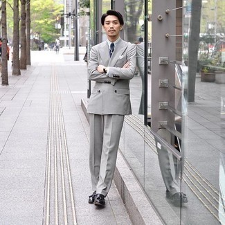 Grey Suit Outfits: For sharp style with a contemporary spin, you can dress in a grey suit and a white dress shirt. Black leather tassel loafers will create a stylish contrast against the rest of the ensemble.