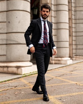 Red Horizontal Striped Tie Outfits For Men: Pairing a black suit and a red horizontal striped tie is a surefire way to infuse your wardrobe with some rugged elegance. You could perhaps get a bit experimental with footwear and introduce black leather tassel loafers to the mix.
