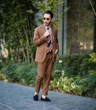 Brown Suit Outfits: You're looking at the indisputable proof that a brown suit and a white and navy vertical striped dress shirt look awesome when worn together in a refined ensemble for a modern dandy. This ensemble is completed nicely with black suede tassel loafers.