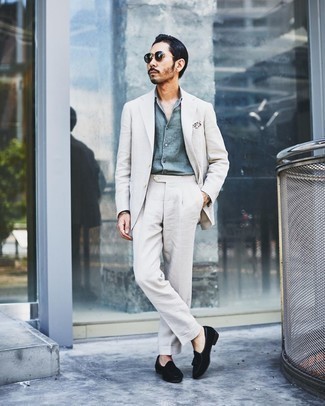 1200+ Dressy Summer Outfits For Men: Teaming a grey suit with a light blue chambray dress shirt is an amazing idea for a dapper and polished outfit. If you want to break out of the mold a little, complete this look with black suede tassel loafers. This one will play especially well come blazing hot sunny days.