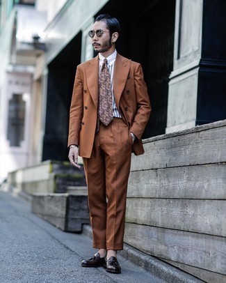 Multi colored Floral Tie Outfits For Men: Marrying a tobacco suit and a multi colored floral tie is a fail-safe way to infuse personality into your day-to-day fashion mix. Dial down the formality of this ensemble by finishing off with dark brown leather tassel loafers.