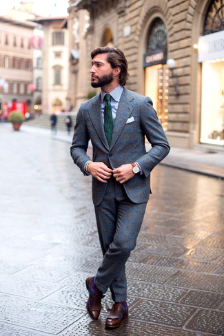 Charcoal Check Wool Suit Outfits: Putting together a charcoal check wool suit with a white and navy vertical striped dress shirt is an on-point pick for a stylish and elegant ensemble. Add a pair of dark brown leather tassel loafers to the mix et voila, this look is complete.