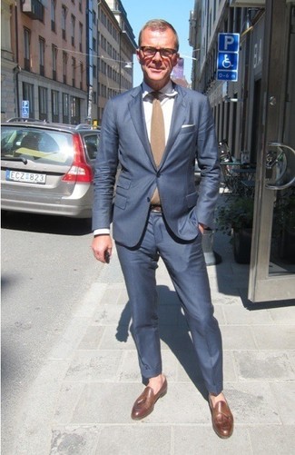Tan Tie Outfits For Men: You'll be surprised at how extremely easy it is to get dressed this way. Just a blue suit teamed with a tan tie. And if you wish to effortlessly tone down your getup with one piece, why not introduce a pair of brown leather tassel loafers to the mix?