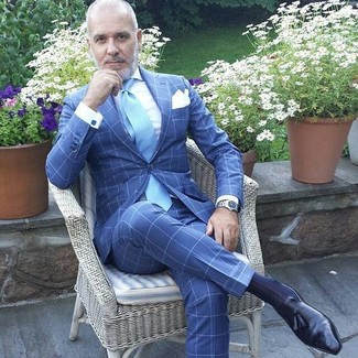 Light Blue Tie Outfits For Men: This combo of a blue check suit and a light blue tie can only be described as outrageously dapper and polished. Put a dressed-down spin on an otherwise sober ensemble by rocking a pair of black leather tassel loafers.