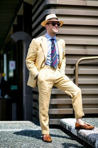 Beige Straw Hat Outfits For Men: A yellow suit and a beige straw hat are the kind of a tested casual outfit that you so awfully need when you have no extra time. Wondering how to finish your look? Finish off with a pair of brown leather tassel loafers to dial it up.