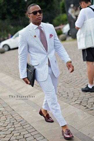 Light Blue Suit Outfits: A light blue suit and a white dress shirt are absolute staples if you're crafting an elegant wardrobe that matches up to the highest sartorial standards. To give your overall outfit a more laid-back finish, throw burgundy leather tassel loafers in the mix.