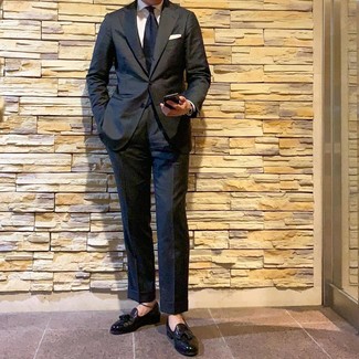 Black Tassel Loafers with Suit Outfits: A suit and a white dress shirt are absolute essentials if you're piecing together a classic wardrobe that holds to the highest menswear standards. Spice up your ensemble with more relaxed shoes, such as these black tassel loafers.