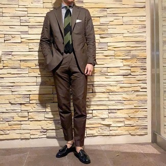 Dark Green Tie Outfits For Men: Reach for a dark brown suit and a dark green tie and you'll exude elegance and refinement. Infuse a dose of stylish casualness into this ensemble by finishing off with black leather tassel loafers.