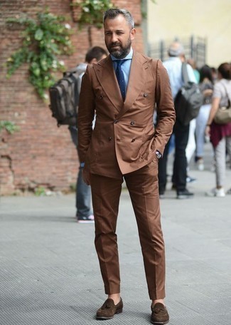 Brown Suit Outfits: This pairing of a brown suit and a light blue dress shirt can only be described as ridiculously sharp and classy. And it's amazing what dark brown suede tassel loafers can do for the look.
