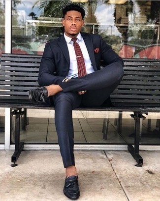Red Polka Dot Tie Outfits For Men: Combining a navy suit with a red polka dot tie is an awesome pick for a smart and refined ensemble. To give your overall getup a more relaxed touch, add a pair of black leather tassel loafers to your outfit.
