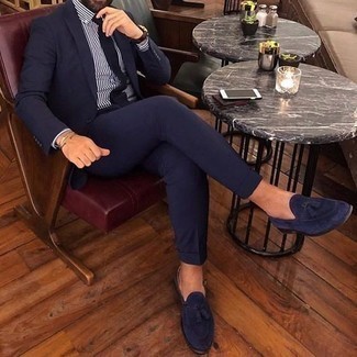 Blue Suede Tassel Loafers Outfits: Pair a navy suit with a white and navy vertical striped dress shirt for a sleek classy getup. A nice pair of blue suede tassel loafers ties this ensemble together.