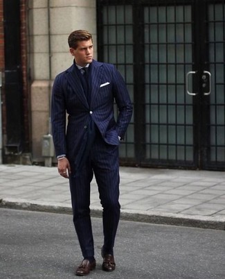 Navy Scarf Outfits For Men: A navy vertical striped suit and a navy scarf are the kind of a never-failing casual outfit that you need when you have zero time to spare. Rounding off with dark brown leather tassel loafers is a fail-safe way to inject an air of polish into your look.