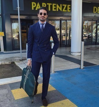 Dark Green Leather Tote Bag Outfits For Men: If you like relaxed dressing, consider pairing a navy vertical striped suit with a dark green leather tote bag. Tap into some Idris Elba dapperness and complete your outfit with a pair of dark brown suede tassel loafers.