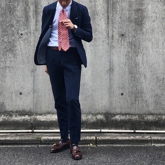 Burgundy Print Tie Outfits For Men: For refined style with a twist, try pairing a navy vertical striped suit with a burgundy print tie. Why not add a pair of dark brown leather tassel loafers to this look for a dash of stylish casualness?