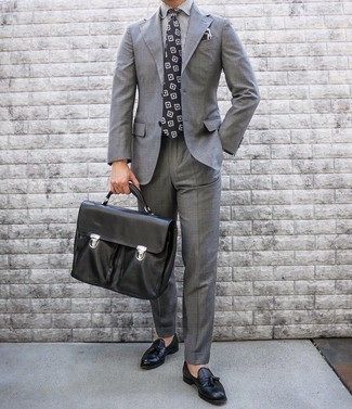 Black Print Tie Outfits For Men: Pairing a grey suit and a black print tie will create a confident, masculine silhouette. Want to tone it down on the shoe front? Introduce black leather tassel loafers to this getup for the day.