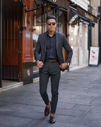 Brown Leather Belt Outfits For Men: Extremely stylish, this relaxed casual combination of a charcoal suit and a brown leather belt provides with variety. A pair of dark brown leather tassel loafers easily kicks up the wow factor of any look.