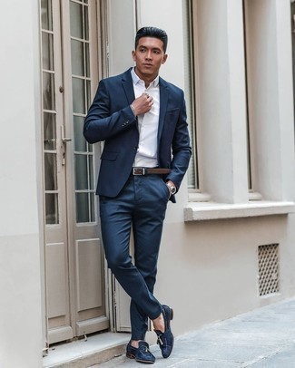 Brown Leather Belt Outfits For Men: A navy suit and a brown leather belt are an easy way to introduce effortless cool into your casual fashion mix. Showcase your refined side by finishing off with navy suede tassel loafers.