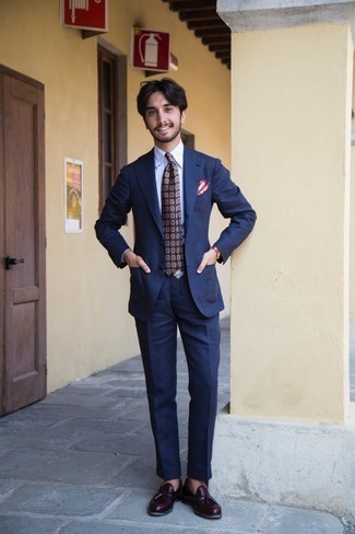 Violet Print Tie Outfits For Men: A navy suit and a violet print tie are a really smart look for you to try. Finish this ensemble with a pair of burgundy leather tassel loafers for a truly modern on and off-duty mix.