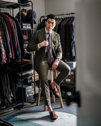 Olive Suit Outfits: This outfit suggests that it is totally worth investing in such timeless menswear items as an olive suit and a white and blue vertical striped dress shirt. Complete this look with a pair of brown suede tassel loafers for extra style points.